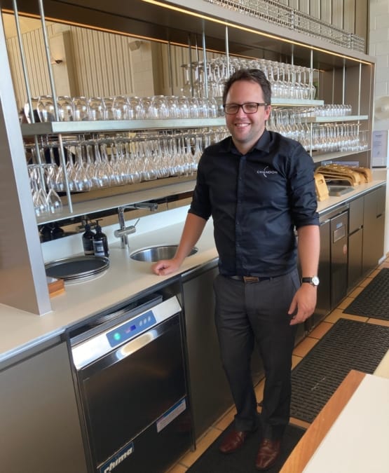 Craig in the bar at Chandon washing glasses with Rhima