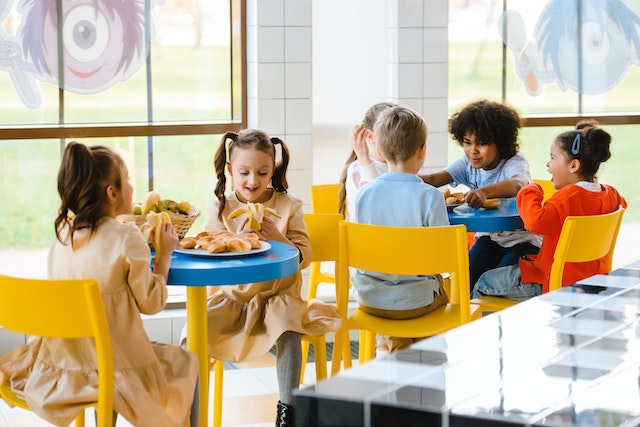 Kids eating in a canteen